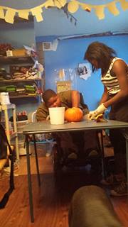 Xzavier Davis-Bilbo and sister Aurie Parris carve a pumpkin for Halloween 2013